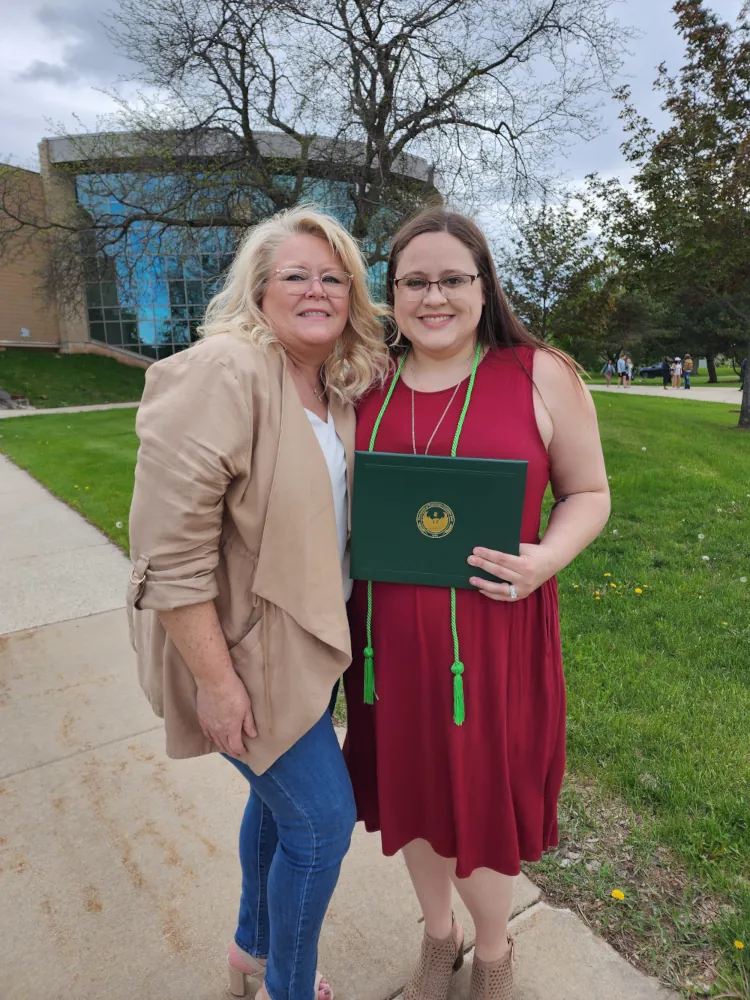 My mother and I outside of UW Green Bay with my degree