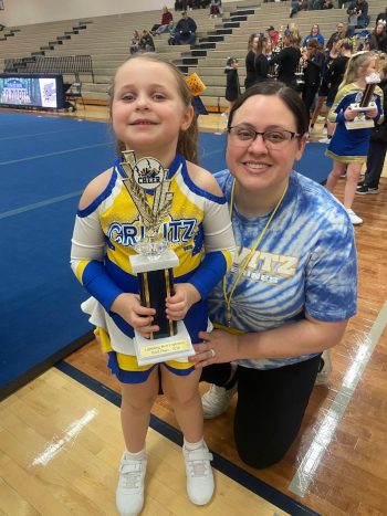 My daughter with a cheer-leading trophy